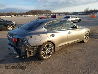 2014 Infiniti Q50 Hybrid Sport with VIN JN1AV7AP4EM691658, listed as a IAAI auction lot 41164910 with 90,521 mi miles and . Bid and sale history available at DreamBid. Image 4.
