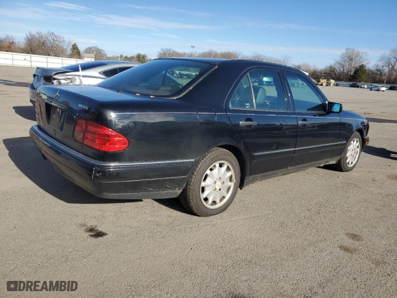 1996 Mercedes-Benz E Class with VIN WDBJF20F9TJ023003, listed as a Copart auction lot 86356784 with 230,944 mi miles and Salvage Title. Bid and sale history available at carsss.com. Image 3.