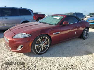 2013 Jaguar XK with VIN SAJWA4GB9DLB51059, listed as a Copart auction lot 77322014 with 0 mi miles and Salvage Title. Bid and sale history available at carsss.com. Image 1.