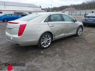 2013 Cadillac XTS Luxury z VIN 2G61R5S30D9174924, wystawiony jako IAAI lot #41958461 z przebiegiem 78 673 mil mil oraz . Historia ofert i sprzedaży dostępna na DreamBid. Obrazek 4.