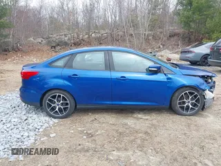 2018 Ford Focus SE z VIN 1FADP3F25JL255840, wystawiony jako IAAI lot #41852913 z przebiegiem 64 010 mil mil oraz . Historia ofert i sprzedaży dostępna na DreamBid. Obrazek 13.