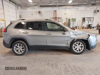 2014 Jeep Cherokee Latitude with VIN 1C4PJLCS1EW106004, listed as a IAAI auction lot 41786457 with 145,588 mi miles. Bid and sale history available at carsss.com. Image 13.