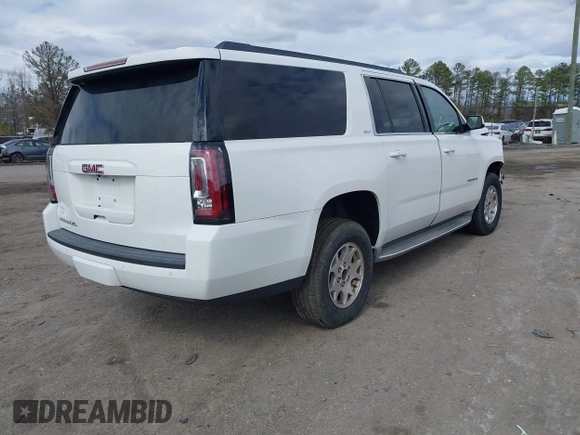 2015 GMC Yukon XL SLT with VIN 1GKS1HKC7FR126375, listed as a IAAI auction lot 41689017 with 218,622 mi miles. Bid and sale history available at carsss.com. Image 4.