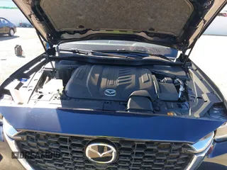 2024 Mazda CX-90 Select z VIN JM3KKAHDXR1170154, wystawiony jako IAAI lot #40852871 z przebiegiem 4 498 mil mil oraz . Historia ofert i sprzedaży dostępna na DreamBid. Obrazek 10.