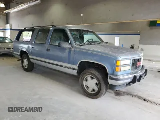 1994 GMC Suburban z VIN 1GKFK16K3RJ725171, wystawiony jako Copart lot #57914635 z przebiegiem 226 183 mil mil oraz Tytuł czysty. Historia ofert i sprzedaży dostępna na DreamBid. Obrazek 4.