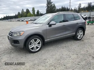 2012 Volkswagen Touareg Sport with VIN WVGFK9BP4CD001860, listed as a Copart auction lot 55090375 with 153,456 mi miles and Salvage title. Bid and sale history available at DreamBid. Image 1.