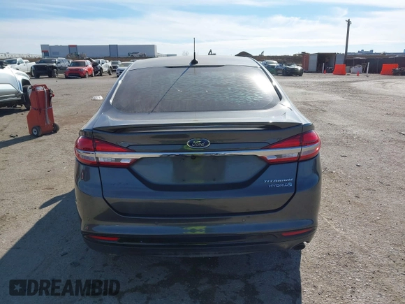 2017 Ford Fusion Hybrid Titanium z VIN 3FA6P0RU0HR314681, wystawiony jako IAAI lot #41288256 z przebiegiem 174 027 mil mil oraz . Historia ofert i sprzedaży dostępna na DreamBid. Obrazek 16.