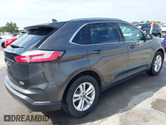 2020 Ford Edge SEL z VIN 2FMPK3J9XLBA54556, wystawiony jako IAAI lot #42179907 z przebiegiem 63 449 mil mil oraz . Historia ofert i sprzedaży dostępna na DreamBid. Obrazek 4.