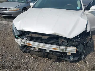 2014 Ford Fusion Titanium Hybrid with VIN 3FA6P0RU0ER329063, listed as a IAAI auction lot 40072913 with 210,274 mi miles. Bid and sale history available at carsss.com. Image 6.