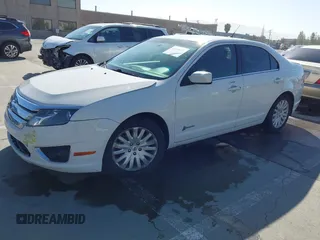 2012 Ford Fusion Hybrid z VIN 3FADP0L3XCR276182, wystawiony jako IAAI lot #42260450 z przebiegiem 133 567 mil mil oraz . Historia ofert i sprzedaży dostępna na DreamBid. Obrazek 17.