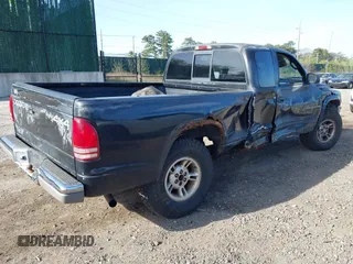 1999 Dodge Dakota SLT with VIN 1B7GG22X8XS115282, listed as a IAAI auction lot 42136576 with 220,465 mi miles and . Bid and sale history available at carsss.com. Image 4.