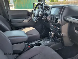2014 Jeep Wrangler Unlimited Sport with VIN 1C4HJWDG4EL159619, listed as a IAAI auction lot 42176313 with 79,715 mi miles and . Bid and sale history available at DreamBid. Image 5.