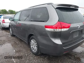 2014 Toyota Sienna XLE with VIN 5TDYK3DC0ES502482, listed as a IAAI auction lot 41910683 with 151,330 mi miles. Bid and sale history available at carsss.com. Image 3.