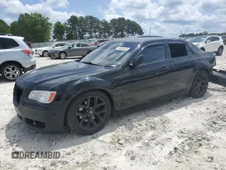 2013 Chrysler 300 C z VIN 2C3CCAETXDH657407, wystawiony jako Copart lot #54854405 z przebiegiem 127 024 mil mil oraz Szkoda całkowita • Salvage title. Historia ofert i sprzedaży dostępna na DreamBid. Obrazek 1.