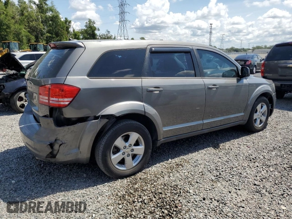 2013 Dodge Journey American Value with VIN 3C4PDCAB8DT566999, listed as a Copart auction lot 61361315 with 183,897 mi miles and Salvage title. Bid and sale history available at DreamBid. Image 3.