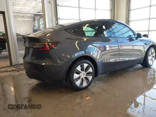 2021 Tesla Model Y Long Range with VIN 5YJYGDEE2MF087871, listed as a IAAI auction lot 41370004 with 85,757 mi miles. Bid and sale history available at carsss.com. Image 4.
