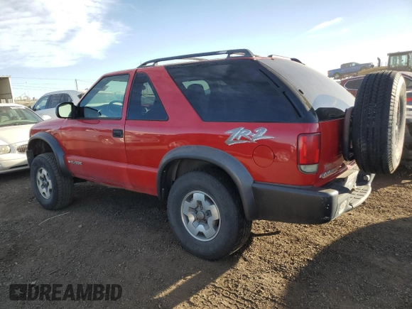 2004 Chevrolet Blazer LS z VIN 1GNCT18X34K141674, wystawiony jako Copart lot #85500954 z przebiegiem Nie podano mil oraz Czysty tytuł • Clean title. Historia ofert i sprzedaży dostępna na DreamBid. Obrazek 2.