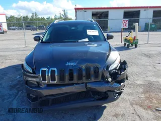 2016 Jeep Cherokee Altitude with VIN 1C4PJLCSXGW363598, listed as a IAAI auction lot 41670125 with 135,603 mi miles. Bid and sale history available at carsss.com. Image 12.