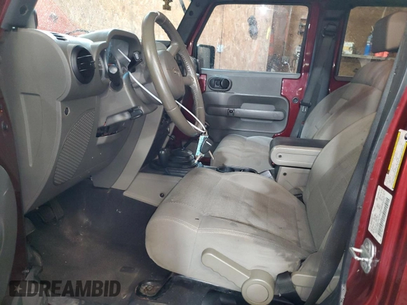 2007 Jeep Wrangler Unlimited Sahara with VIN 1J4GA59197L104784, listed as a Copart auction lot 56700205 with 156,382 mi miles and Salvage title. Bid and sale history available at DreamBid. Image 7.