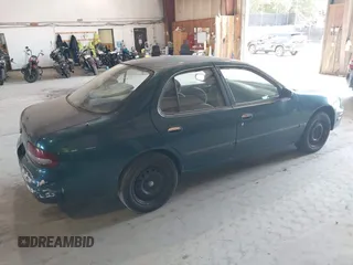 1996 Nissan Altima XE with VIN 1N4BU31D4TC139105, listed as a IAAI auction lot 40241213 with 115,817 mi miles and . Bid and sale history available at DreamBid. Image 4.