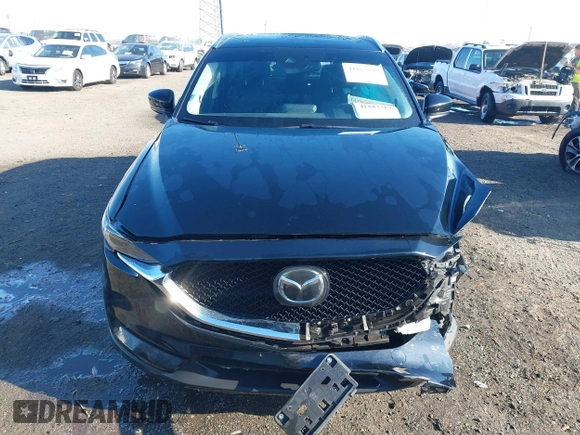 2020 Mazda CX-5 Grand Touring with VIN JM3KFBDM0L0790508, listed as a IAAI auction lot 41883319 with 114,398 mi miles and . Bid and sale history available at carsss.com. Image 12.
