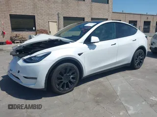 2023 Tesla Model Y Long Range with VIN 7SAYGDEE8PF612438, listed as a IAAI auction lot 41991145 with 29,775 mi miles and . Bid and sale history available at carsss.com. Image 2.