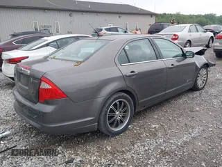 2011 Ford Fusion Hybrid with VIN 3FADP0L39BR345250, listed as a IAAI auction lot 42319401 with 321,317 mi miles and . Bid and sale history available at DreamBid. Image 4.