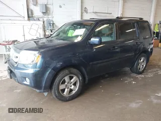 2011 Honda Pilot EX-L with VIN 5FNYF4H66BB020176, listed as a IAAI auction lot 41973659 with 238,745 mi miles and . Bid and sale history available at carsss.com. Image 2.