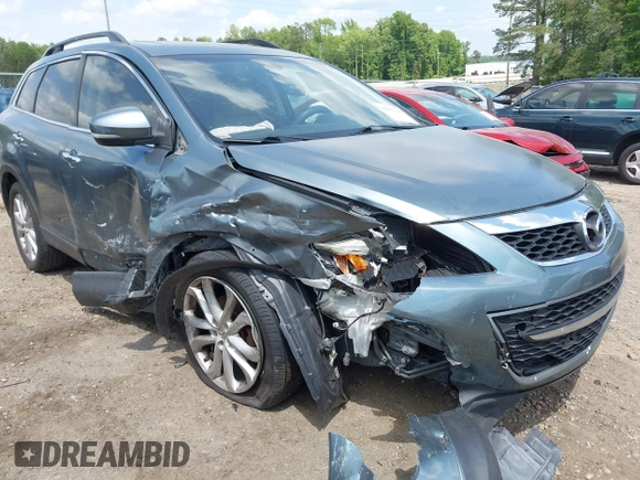 2012 Mazda CX-9 Grand Touring z VIN JM3TB2DA1C0334863, wystawiony jako IAAI lot #42157222 z przebiegiem 277 786 mil mil oraz . Historia ofert i sprzedaży dostępna na DreamBid. Obrazek 1.