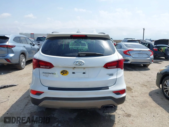 2018 Hyundai Santa Fe 2.4L z VIN 5NMZUDLB3JH055771, wystawiony jako IAAI lot #42126058 z przebiegiem 142 991 mil mil oraz . Historia ofert i sprzedaży dostępna na DreamBid. Obrazek 16.