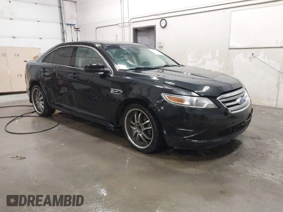 2011 Ford Taurus SEL with VIN 1FAHP2EW4BG160633, listed as a IAAI auction lot 41778406 with 125,934 mi miles. Bid and sale history available at carsss.com. Image 1.