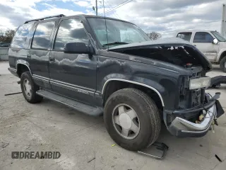 1999 GMC Yukon with VIN 1GKEK13R9XJ803351, listed as a Copart auction lot 81800974 with 0 mi miles and Salvage Title. Bid and sale history available at carsss.com. Image 4.