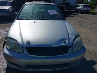 1999 Honda Civic VP with VIN 2HGEJ6616XH537100, listed as a IAAI auction lot 42018708 with 229,594 mi miles. Bid and sale history available at carsss.com. Image 6.