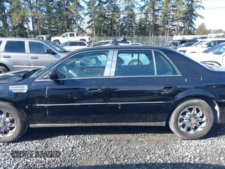 2006 Cadillac DTS 1SC z VIN 1G6KD57YX6U100634, wystawiony jako IAAI lot #41671007 z przebiegiem Nie podano mil oraz . Historia ofert i sprzedaży dostępna na DreamBid. Obrazek 14.