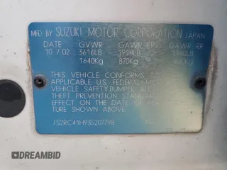 2003 Suzuki Aerio SX z VIN JS2RC41H935207798, wystawiony jako Copart lot #46543305 z przebiegiem 116 752 mil mil oraz Szkoda całkowita • Salvage title. Historia ofert i sprzedaży dostępna na DreamBid. Obrazek 13.