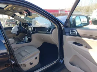 2021 Jeep Grand Cherokee 80th Anniversary with VIN 1C4RJFBG0MC801971, listed as a IAAI auction lot 41661098 with 31,961 mi miles and . Bid and sale history available at DreamBid. Image 5.