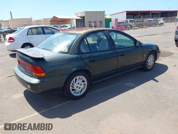 1999 Saturn SL z VIN 1G8ZK5274XZ351289, wystawiony jako IAAI lot #41734679 z przebiegiem 140 006 mil mil oraz . Historia ofert i sprzedaży dostępna na DreamBid. Obrazek 4.