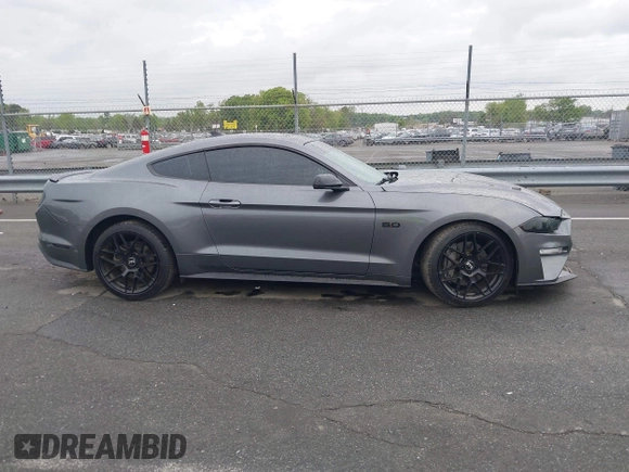 2021 Ford Mustang GT z VIN 1FA6P8CF0M5105060, wystawiony jako IAAI lot #41967671 z przebiegiem 27 626 mil mil oraz . Historia ofert i sprzedaży dostępna na DreamBid. Obrazek 13.