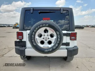 2014 Jeep Wrangler Unlimited Sahara with VIN 1C4BJWEG5EL309502, listed as a Copart auction lot 61804885 with 60,683 mi miles and Salvage title. Bid and sale history available at DreamBid. Image 6.