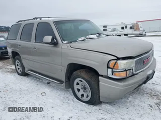 2001 GMC Yukon Denali z VIN 1GKEK63U21J222783, wystawiony jako IAAI lot #41443565 z przebiegiem Nie podano mil oraz . Historia ofert i sprzedaży dostępna na DreamBid. Obrazek 1.