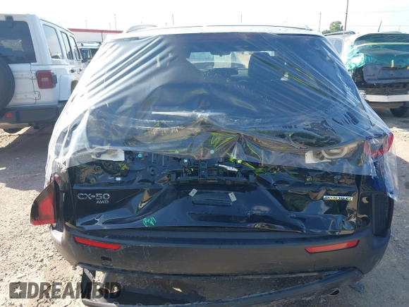 2025 Mazda CX-50 S Preferred z VIN 7MMVABBMXSN337974, wystawiony jako IAAI lot #42238129 z przebiegiem 6 159 mil mil oraz . Historia ofert i sprzedaży dostępna na DreamBid. Obrazek 6.