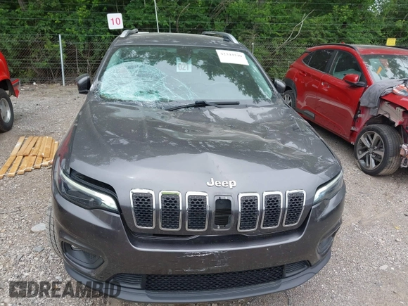 2020 Jeep Cherokee Latitude Plus with VIN 1C4PJMLBXLD580130, listed as a IAAI auction lot 42344240 with 82,814 mi miles and . Bid and sale history available at DreamBid. Image 12.