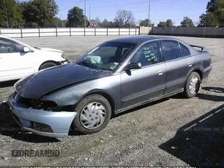 2003 Mitsubishi Galant ES z VIN 4A3AA46G53E217951, wystawiony jako IAAI lot #24872153 z przebiegiem 155 114 mil mil oraz . Historia ofert i sprzedaży dostępna na DreamBid. Obrazek 2.