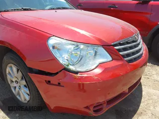 2010 Chrysler Sebring Touring z VIN 1C3CC4FB2AN146011, wystawiony jako IAAI lot #42379595 z przebiegiem 73 179 mil mil oraz . Historia ofert i sprzedaży dostępna na DreamBid. Obrazek 6.
