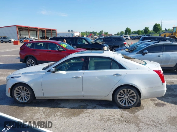 2015 Cadillac CTS Luxury AWD z VIN 1G6AX5SX9F0107244, wystawiony jako IAAI lot #42386444 z przebiegiem 171 413 mil mil oraz . Historia ofert i sprzedaży dostępna na DreamBid. Obrazek 14.