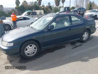 1997 Honda Accord EX w/Leather with VIN 1HGCD7158VA014025, listed as a IAAI auction lot 41582343 with 302,660 mi miles. Bid and sale history available at carsss.com. Image 2.