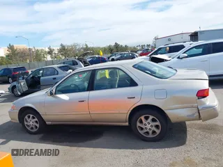 2000 Toyota Camry LE z VIN JT2BF22K5Y0258522, wystawiony jako IAAI lot #41998874 z przebiegiem 300 186 mil mil oraz . Historia ofert i sprzedaży dostępna na DreamBid. Obrazek 14.