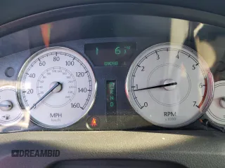 2005 Chrysler 300 C with VIN 2C3AA63H15H525775, listed as a Copart auction lot 52018135 with 59,098 mi miles and Salvage Title. Bid and sale history available at DreamBid. Image 9.