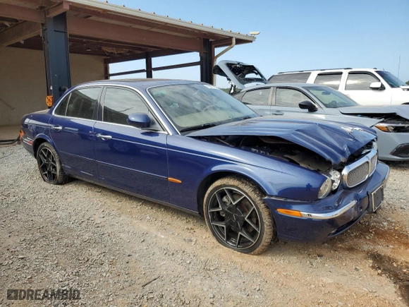 2004 Jaguar XJ with VIN SAJWA71C34SG19800, listed as a Copart auction lot 71877194 with 157,051 mi miles and Salvage Title. Bid and sale history available at carsss.com. Image 4.