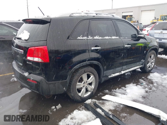 2012 Kia Sorento EX with VIN 5XYKUDA2XCG301636, listed as a IAAI auction lot 41619793 with 220,692 mi miles. Bid and sale history available at carsss.com. Image 4.